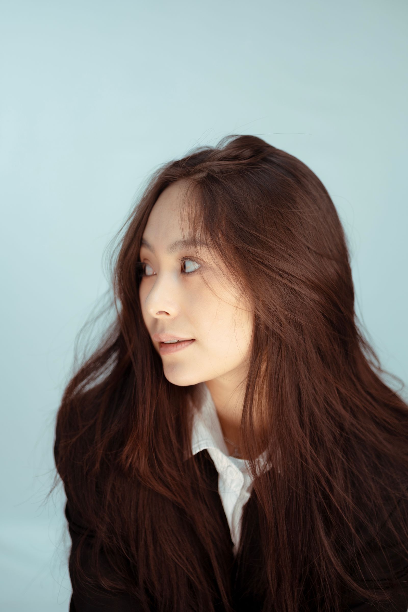 Woman with long, softly waved brown hair